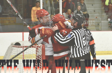 Junior forward TJ Schlueter shows some love to an opponent after a play in an early season game against St. Lawrence. The Western Collegiate Hockey Association regular season wraps up this weekend, with Ferris State Hockey facing Lake Superior State in Big Rapids with a chance to win the regular season championship.  Photo by Harrison Watt, Sports Editor